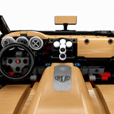 Hypercar Veyron en briques — vue 3/4 arrière avec moteur W16 apparent